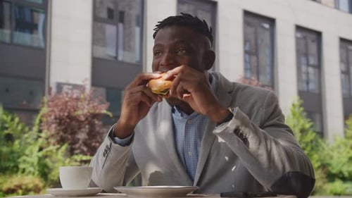 Black Man Eating Burger Outside African American Businessman Enjoying Tasty Burger Sitting in Cafe