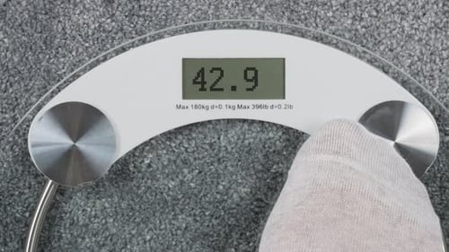 Socks Weighing on Digital Bathroom Scale at Home