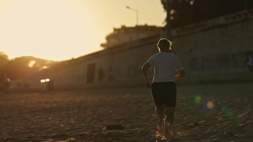 Woman Running on the Beach at Sunset