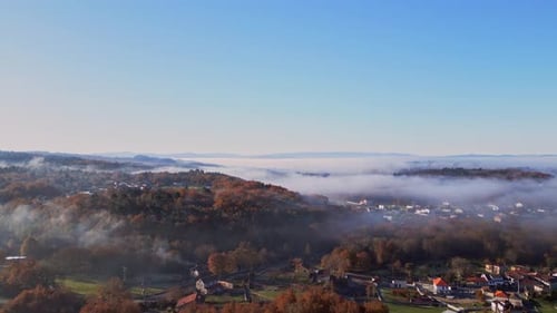Amazing Aerial Shot Of Dense Fog Covering Small Villages And Big Forest