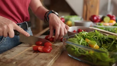 Woman Prepares a Fresh Salad in Kitchen