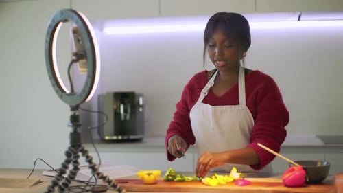 Woman Recording Cooking Video in Kitchen