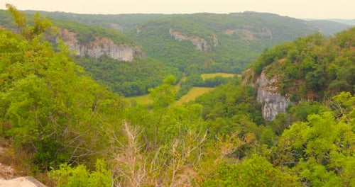 Capturing of Geopark, France during daytime. Wild vegetation on hills.