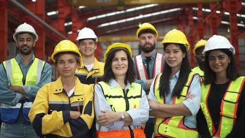 Blue collar worker work at metal sheet factory.