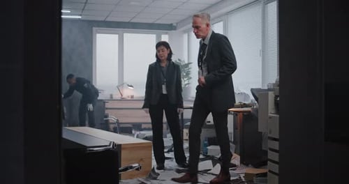 Investigators Inspecting Office Crime Scene