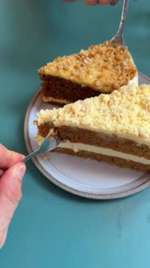 Influencer eating cake. Vertical shot of people taking bites of layered crumb cake with creamy frost