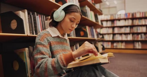 Music, headphones or girl in library reading book at university, college