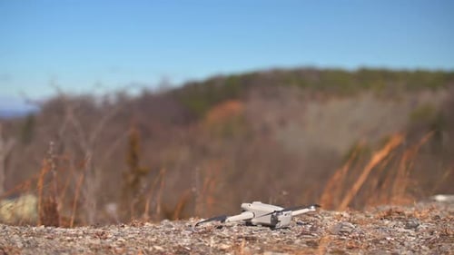 Drone startup and takeoff from mountain top.