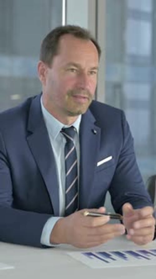 Ambitious Executive Business People giving Presentation on Office Desk, vertical video