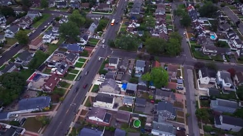 An aerial view over a Long Island residential neighborhood during a cloudy day.