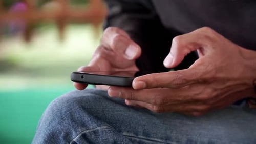 CLOSE UP SHOT OF A MAN HAND TYPE ON SMARTPHONE, slow motion