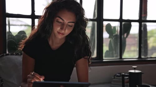 Woman Using Tablet Computer for Art Work and Drawing on Graphics Screen By Pen