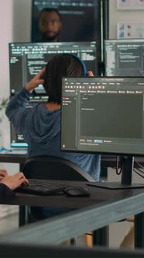 Team of Young Adults Coding in Office