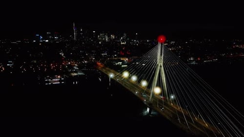 Aerial panoramic shot of Warsaw cityscape. Swietokrzyski suspension bridge over Vistula river, skysc