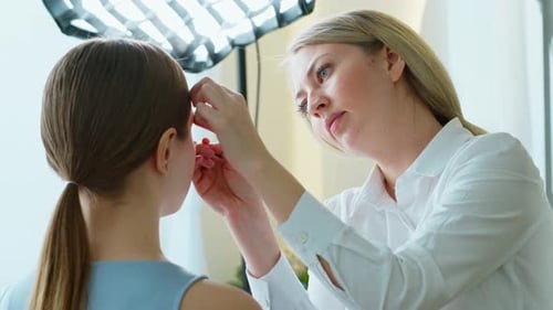 Makeup Artist Work in Her Beauty Studio Portrait of Woman Applying By Professional Make Up Master