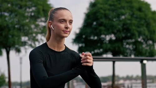 Athletic Woman Doing Squats Exercise Outdoors