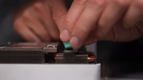 Closeup Cropped Shot of Unrecognizable Technician Delicately Positioning Fresh Thermal Pad Onto