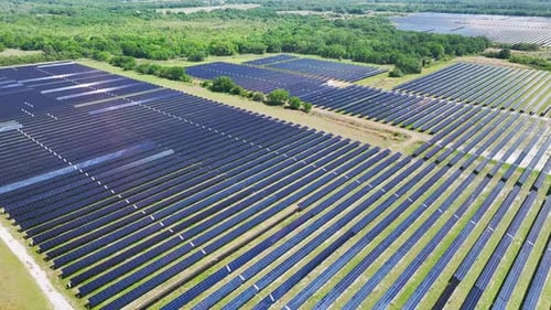 Aerial View of Large Sustainable Electrical Power Plant with Rows of Solar Photovoltaic Panels for