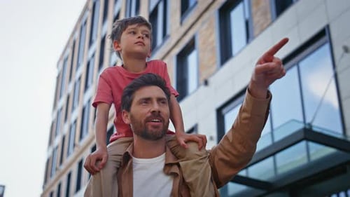 Joyful Dad Piggyback Kid in Urban District Closeup Man Hold Smiling Child Boy