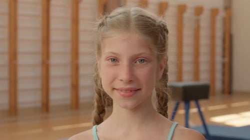 Smiling Girl in Gymnasium Close Up