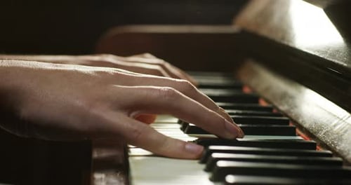 Hands Playing Piano Keys Close Up