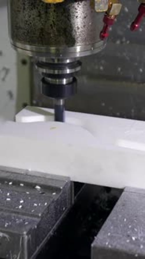 Industrial Machine Drilling White Block