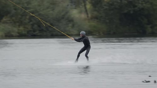 Wakeboard Surfer Riding across Lake at Cable Park