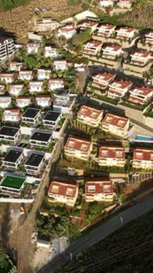 Vertical Video City Chronicles Luxurious Homes and Villa Complexes with Pools in a Small Urban Oasis