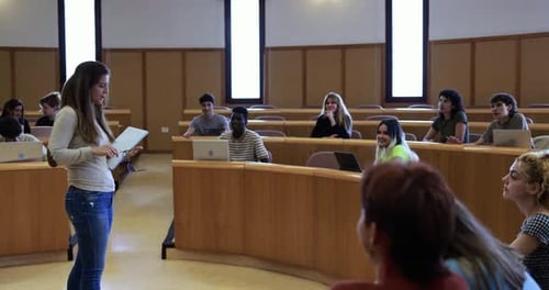 Teacher Working with Students Inside Classroom at School University Academic