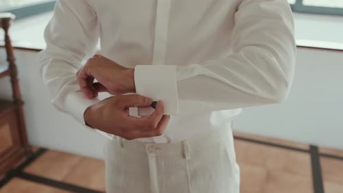 Man Fastening Cufflinks on Elegant White Shirt Sleeve
