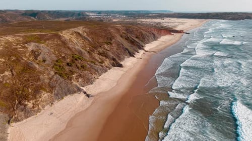 Coastal cliffs and sandy beaches of Portugal captured from above
