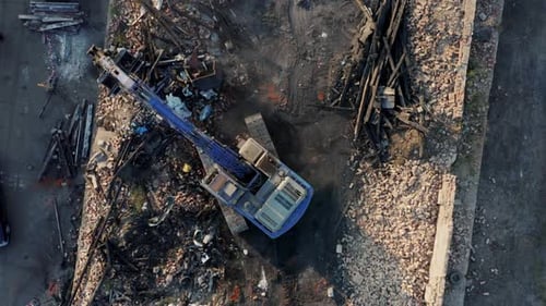 Top Down View of an Excavator Demolishing an Old Building to Build a New Home