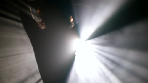 Sexy Woman Dancing Erotic Dance in Darkness Silhouette of Seductive Body Against Bright Light