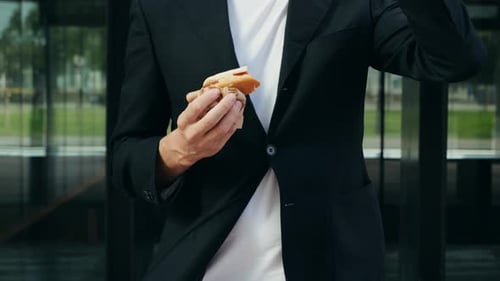 Busy Office Man Guy Eating a Hot Dog Instead of a Proper Lunch and Working Take Away Food Delivery