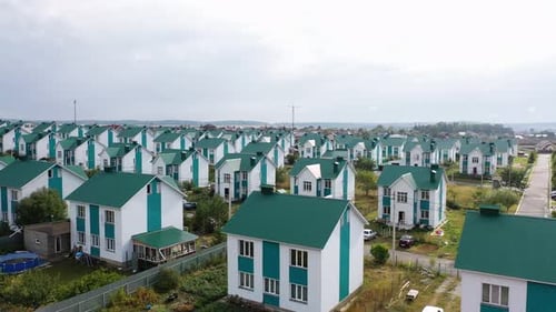 An Aerial View of Several Dozen Identical Houses the Residence of a Community or Commune