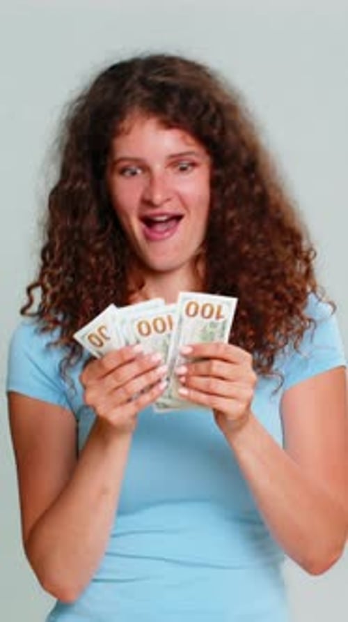 Woman Hold Dollar Cash Money Smiling Satisfied Celebrating Salary Savings Loan Financial Success Joy
