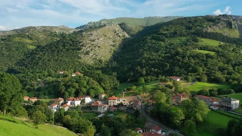 flight in a rural village with its agricultural and livestock environment, its green meadows in summ