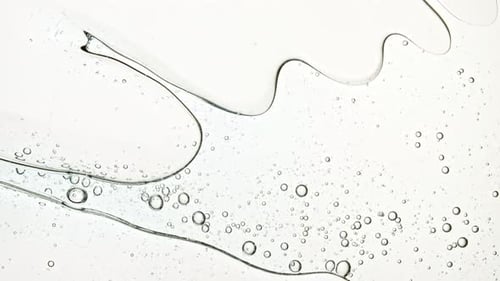 Abstract Liquid with Bubbles Flowing on White