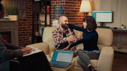 Couple embracing during therapy session