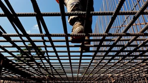 Worker on iron bars