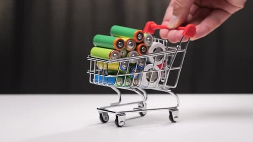 Toy Shopping Cart Full of Multi-Colored Batteries