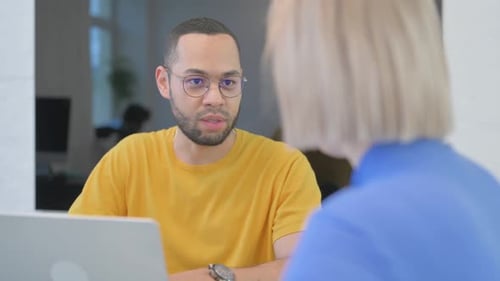 Close up of Creative People Talking at Work