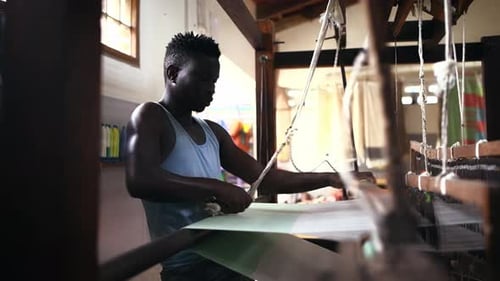 Man, loom and fabric or textiles and cotton production at clothing factory