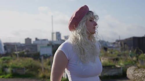 Woman With Beret Looking Out at the City