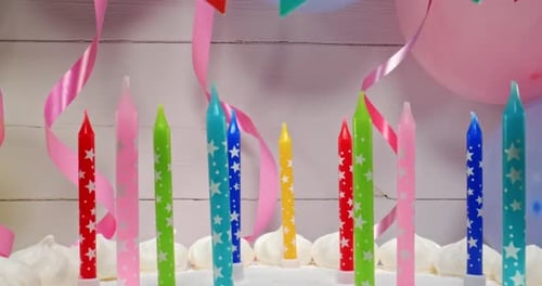 Whimsical Birthday Cake with Candles and Decorations