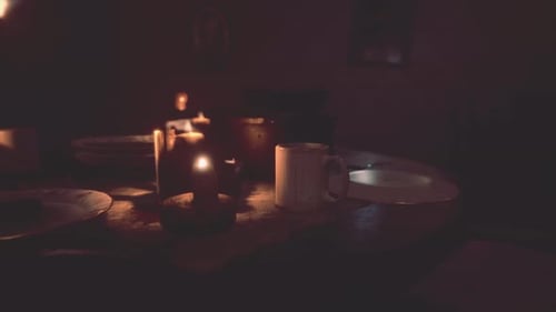 Warm Candlelight Glow on a Dinner Table