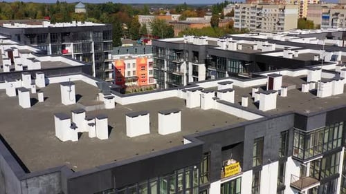 New architecture in the city. High-raise apartment buildings near the road.