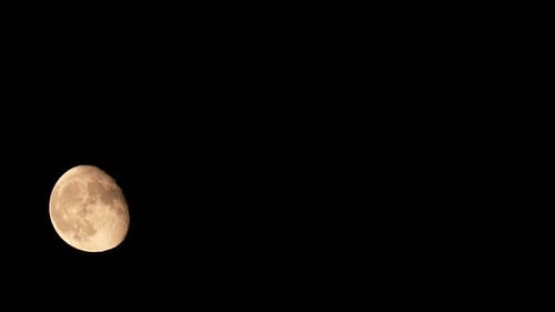 Close Up Crescent Moon Moving Across the Night Sky