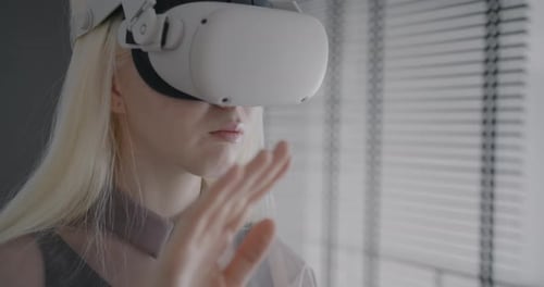 Woman Using Virtual Reality Headset in Bright Room