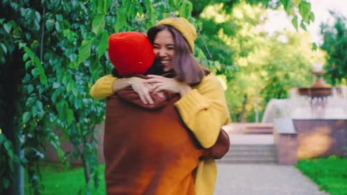 A Joyful Couple Meets in the Park As the Woman Runs to the Man and Embraces Him Warmly They Spin